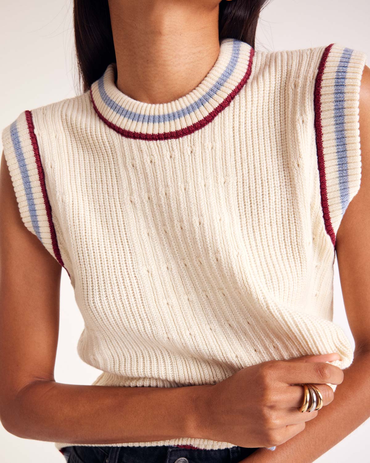 Ecru Pearl sweater with blue and red trim