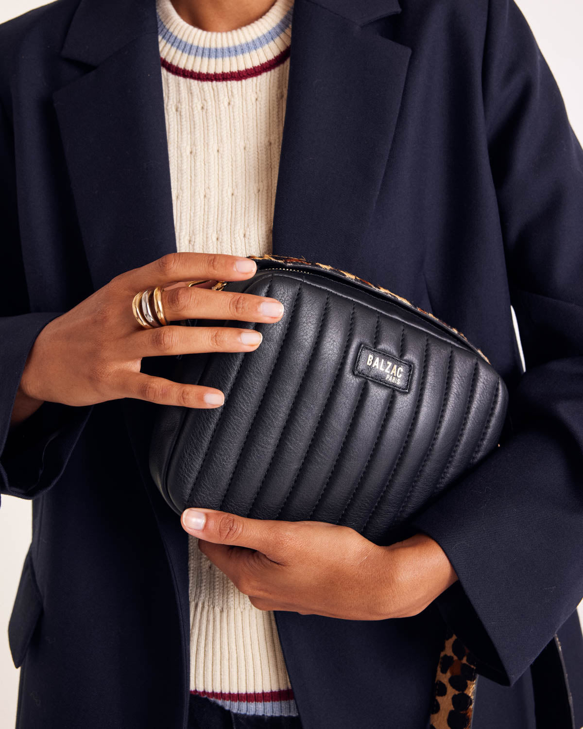 Ecru Pearl sweater with blue and red trim