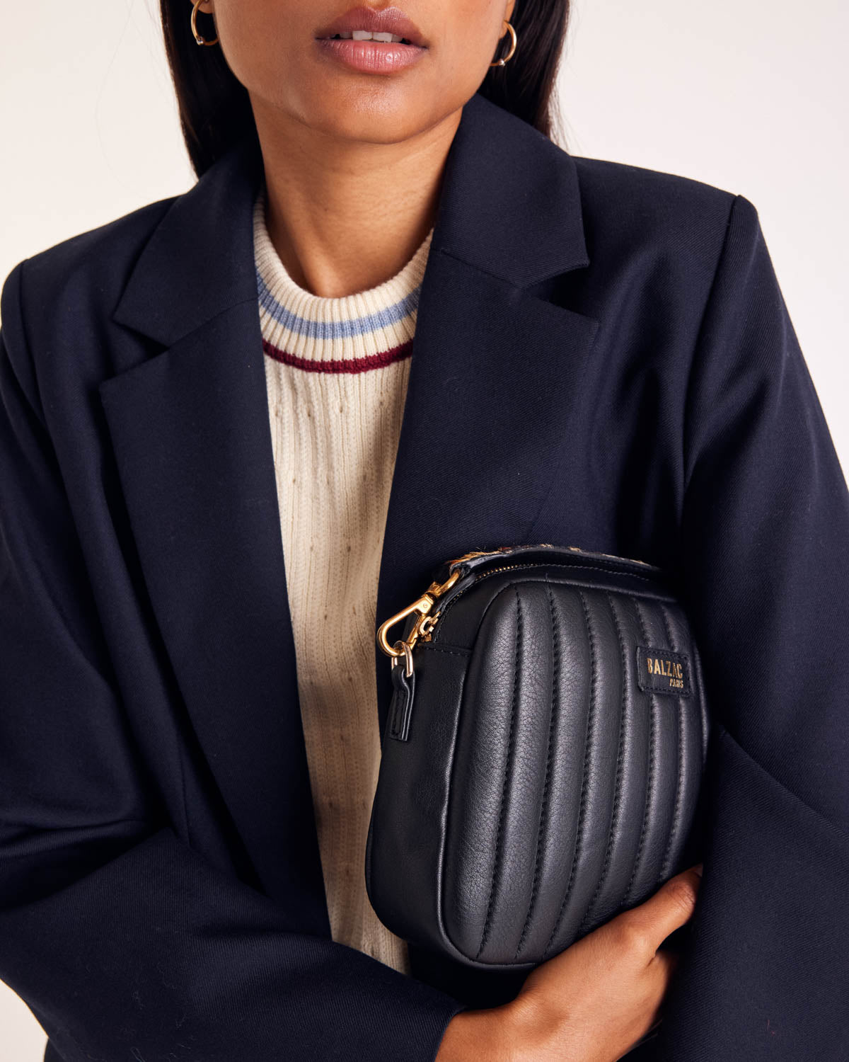 Ecru Pearl sweater with blue and red trim