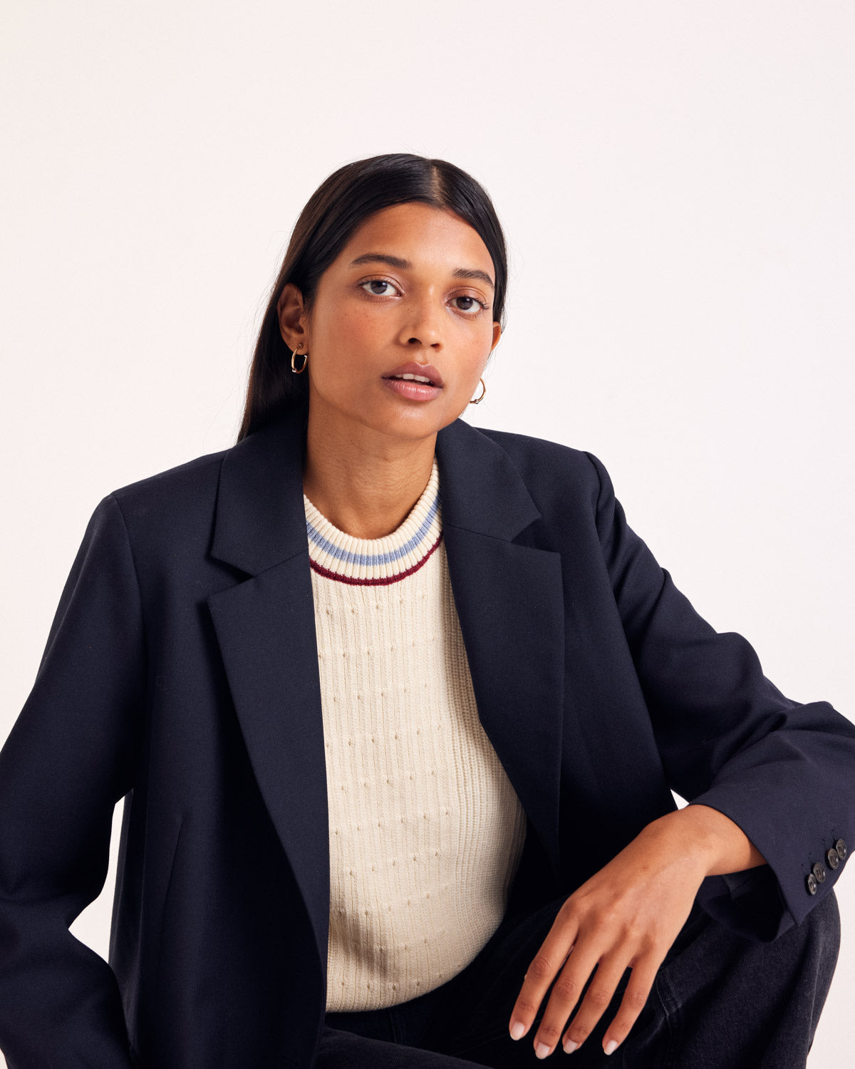 Ecru Pearl sweater with blue and red trim